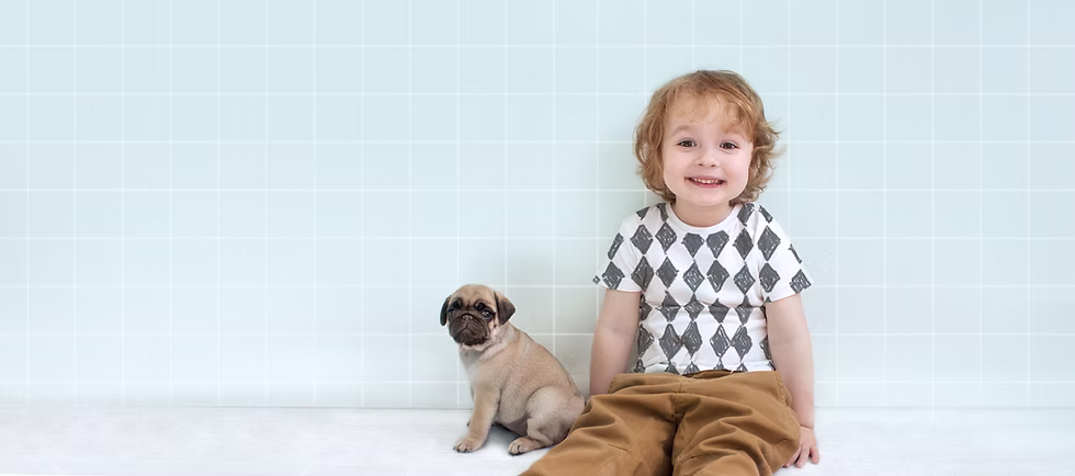 Boy with Pug Puppy